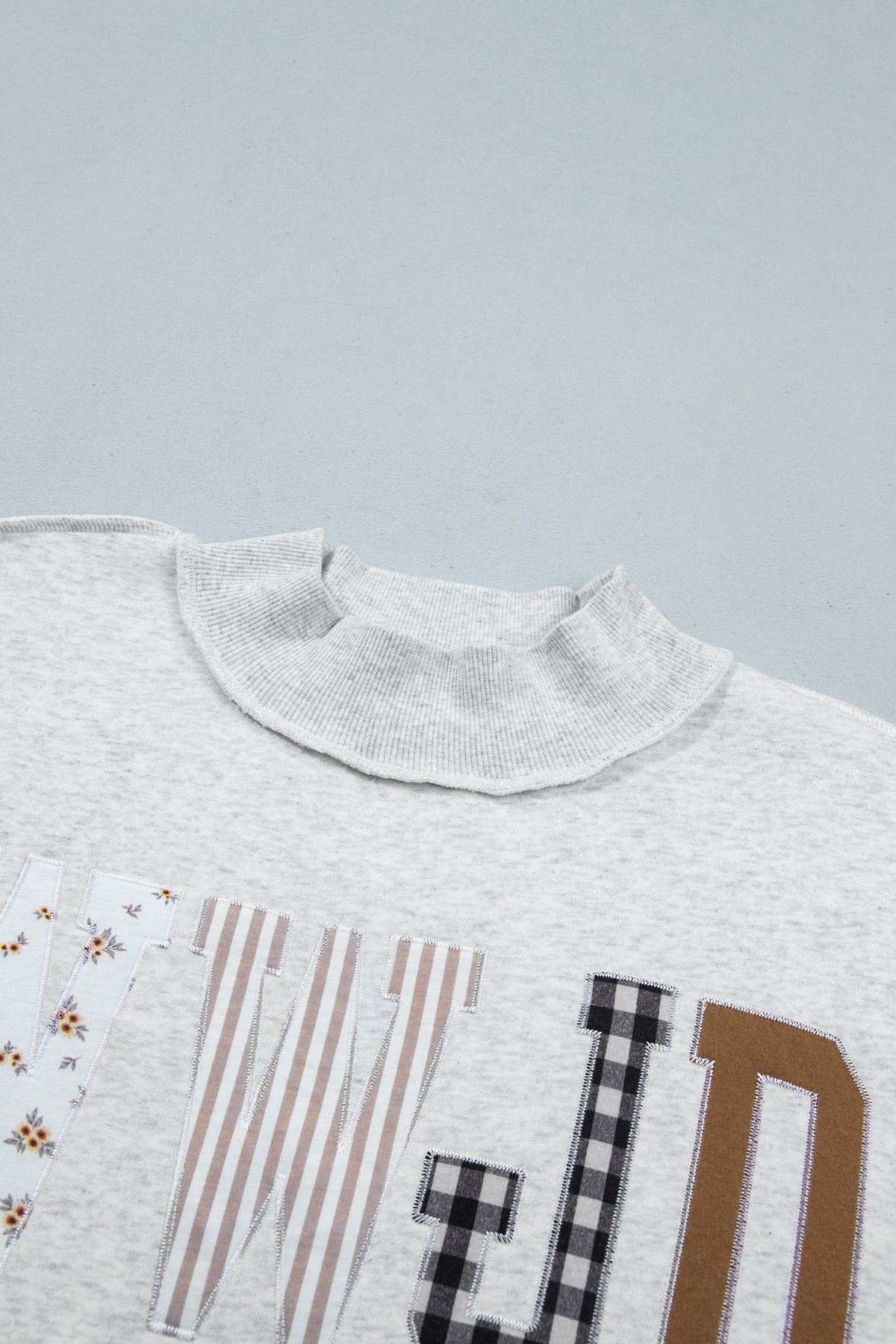 WWJD Mixed Pattern Embroidered Patch Graphic Mock Neck Sweatshirt
