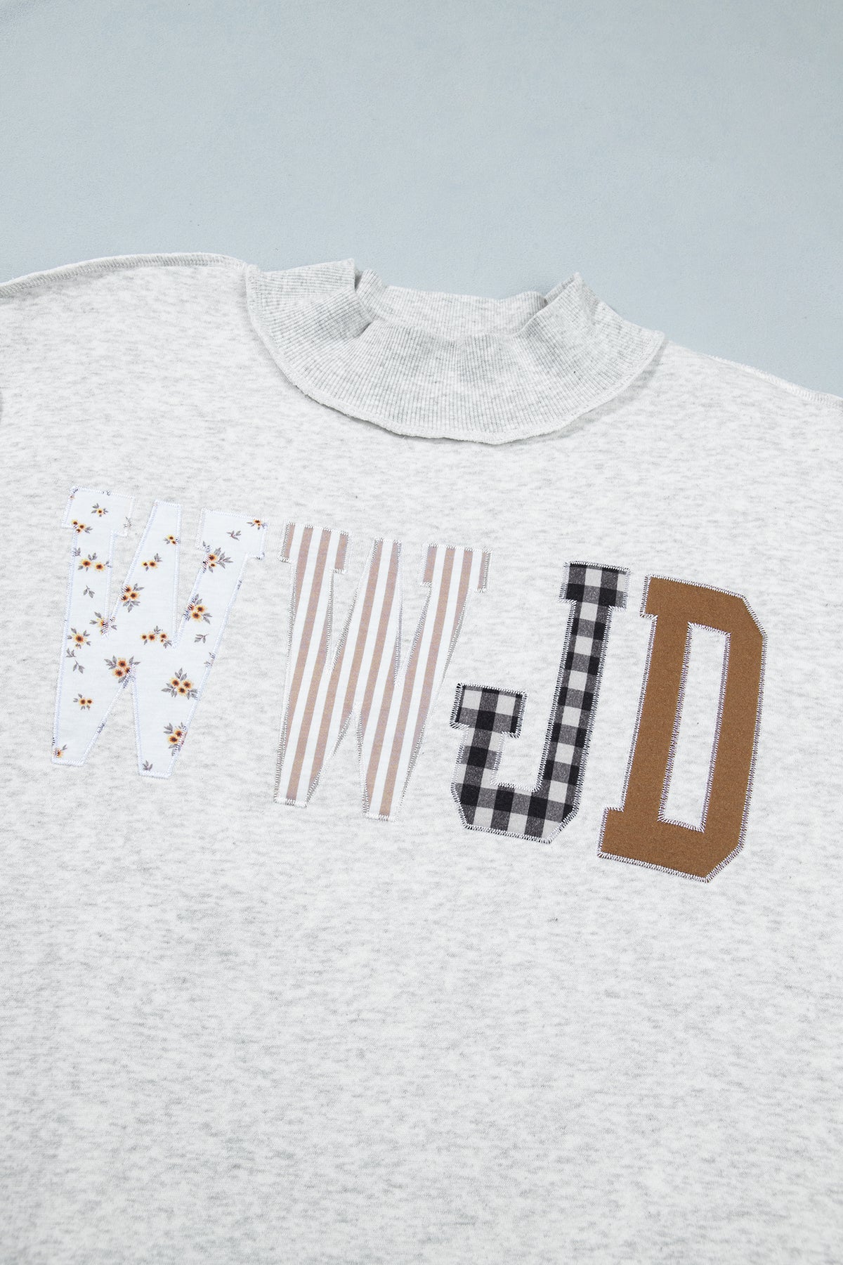 WWJD Mixed Pattern Embroidered Patch Graphic Mock Neck Sweatshirt